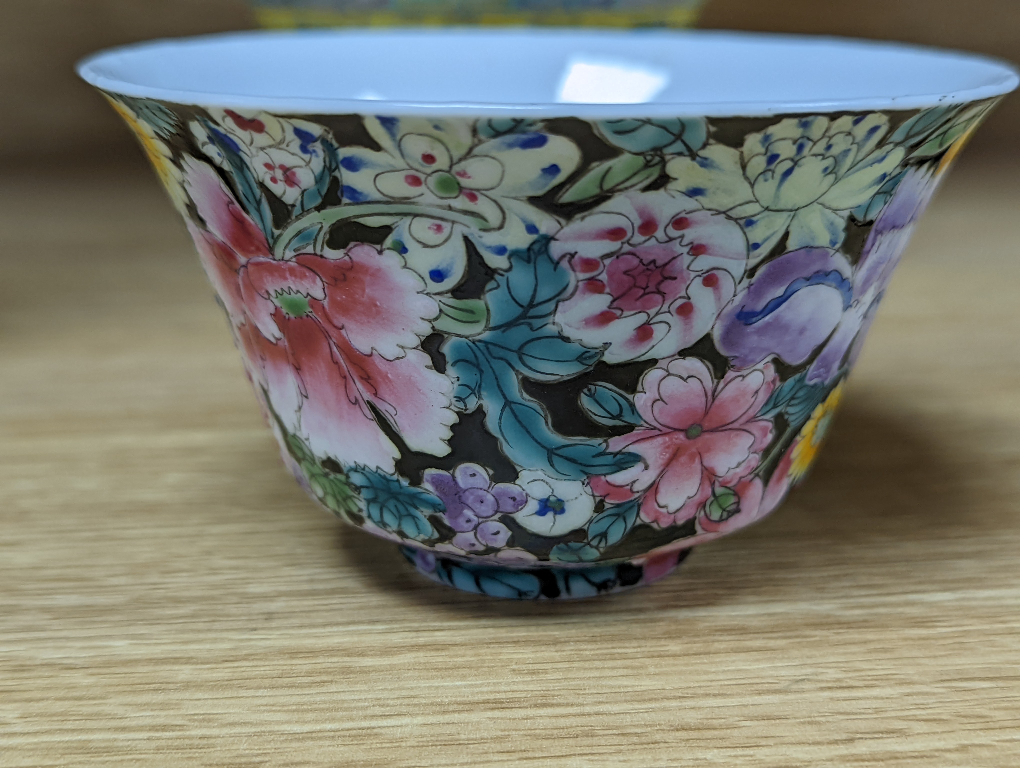 A pair of Chinese enamelled porcelain rice bowls, covers and stands and an odd bowl